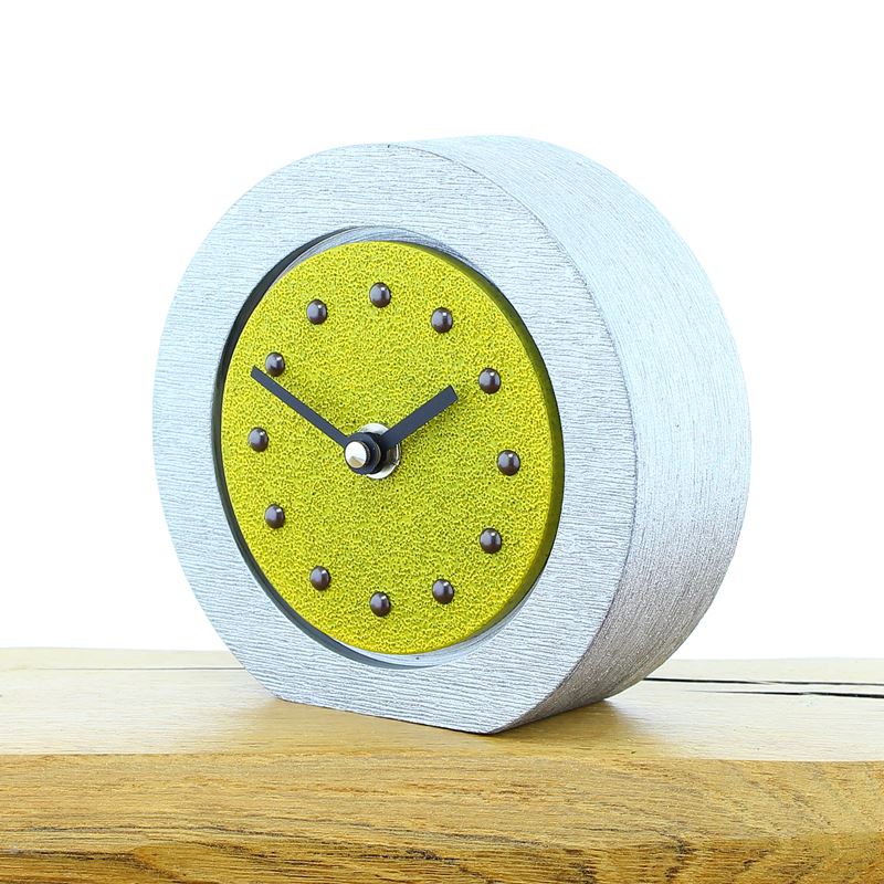 Round Yellow Mantel Clock, Silver Frame, Antique Studs, Black Hands